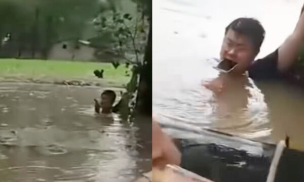 中国の大洪水の中　口にスマホくわえ位置情報を共有し　救助された男性